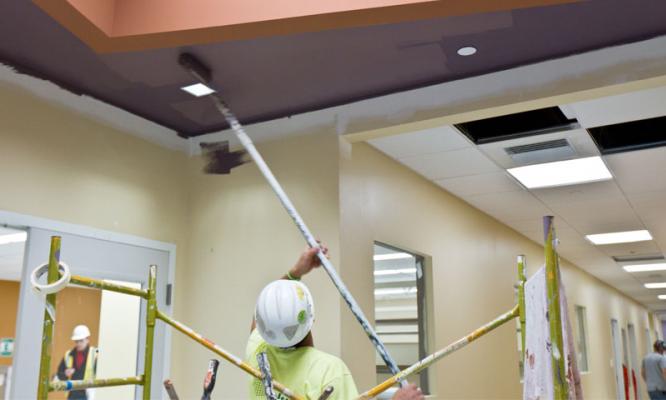 Our team painting ceiling of a building